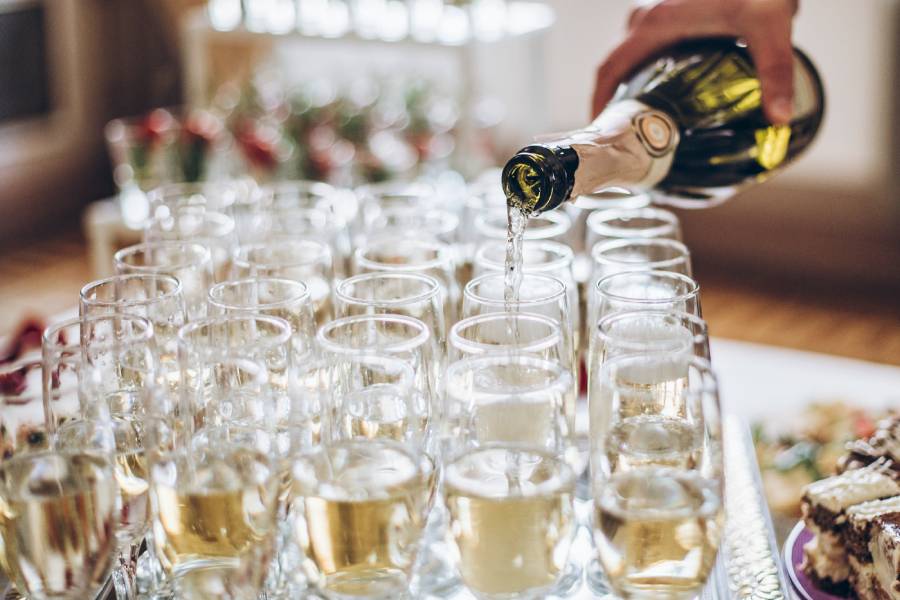 waiter-pouring-champagne-in-stylish-glasses-at-lux-2022-02-02-03-59-28-utc-2